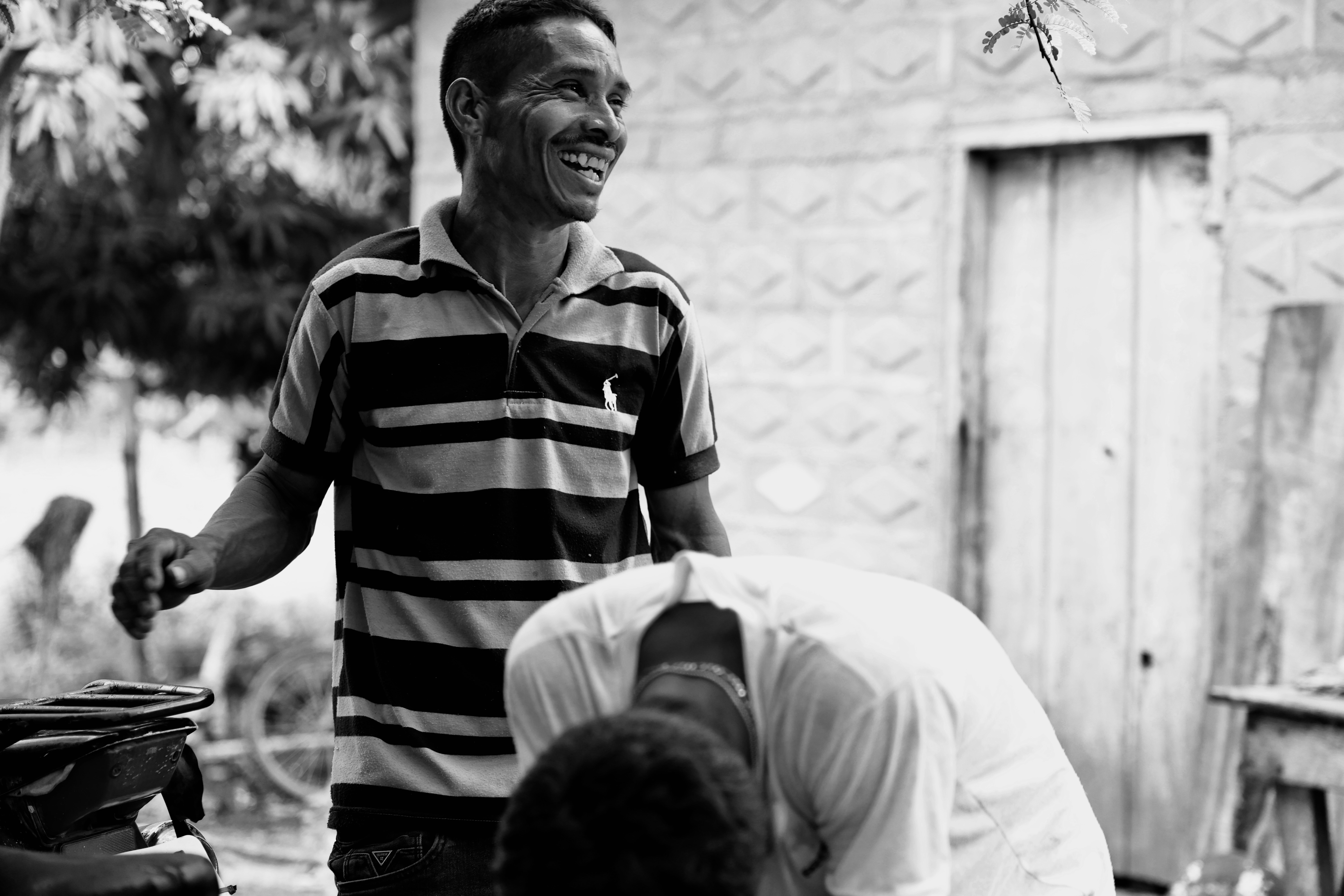 The father laughing — black and white