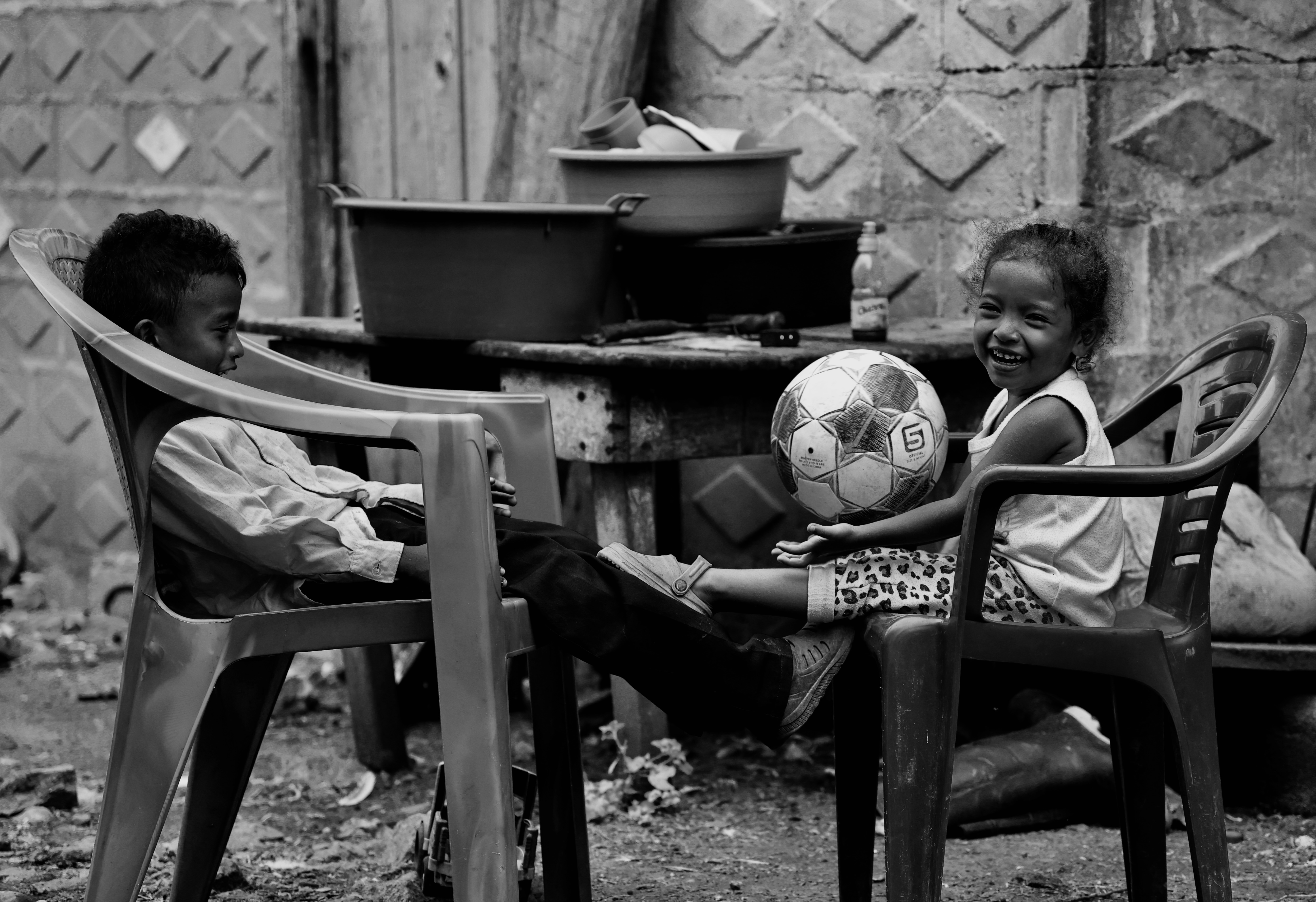 The youngest kids playing — black and white